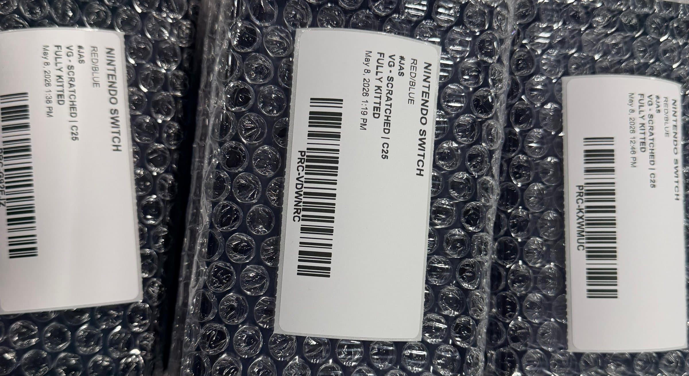 Three bubble wrapped consoles labelled with matching condition, station and timestamps